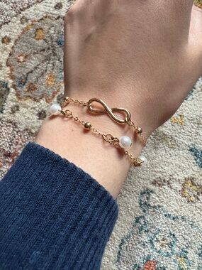 Gold Colored Chain Bracelets with Butterfly, Pearl, and an Infinity Sign Detail